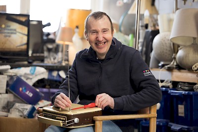 Martyn repairs a radio.