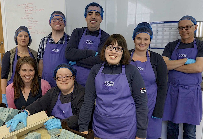 Scottish communities secretary Aileen Campbell at Shetland Soap on Tuesday with L-R Karen Blair, Darren Johnson, Louise Jamieson, Robbie Inkster, Julie Sandison, Siobhan Scott-Miller and Marc Chivers. Photo: Peter Johnson/Shetland News