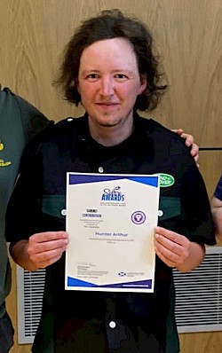 Hunter Arthur with his Summit Award