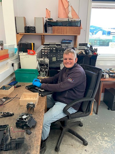 Gareth working on recycling and repairs