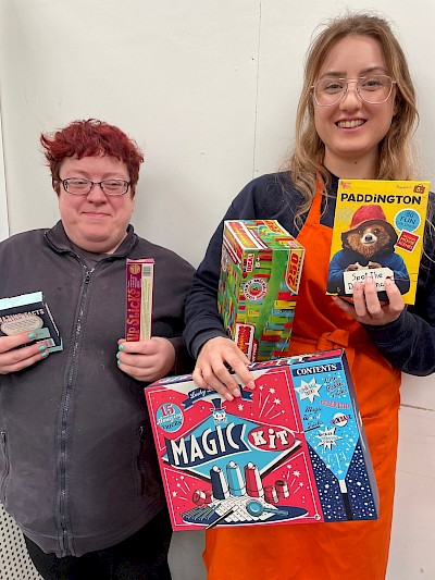 Louise and Jenni gathering a selection of the toys and games available at the Shetland Home Co.